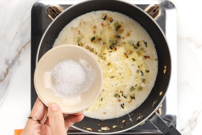 Add the broth, milk, cream, and salt to the saucepan.