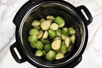 Step 1: Add water to the Instant Pot. Arrange Brussels sprouts in the basket.