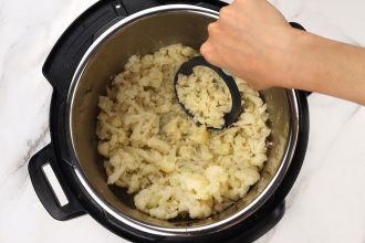 Step 2: Perform a quick release of the steam. Roughly mash the cauliflower.