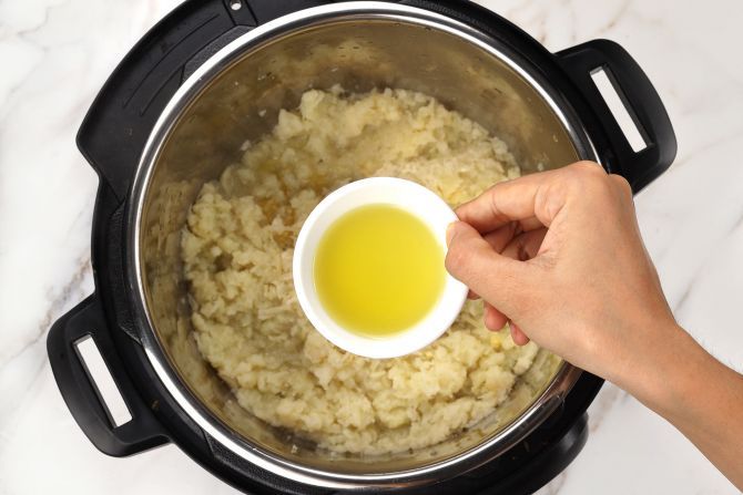 Step 3: Stir seasonings and olive oil into the roughly-mashed cauliflower. Cook on the “Sauté” setting for 1 minute.