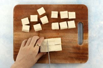 step 3: Cut the tofu into bite-sized cubes and transfer them to a tossing bowl.