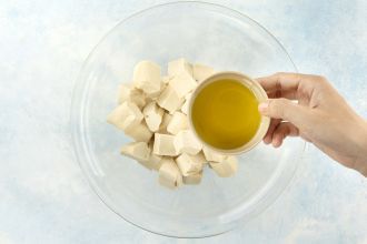 step 4: Toss the tofu with olive oil.