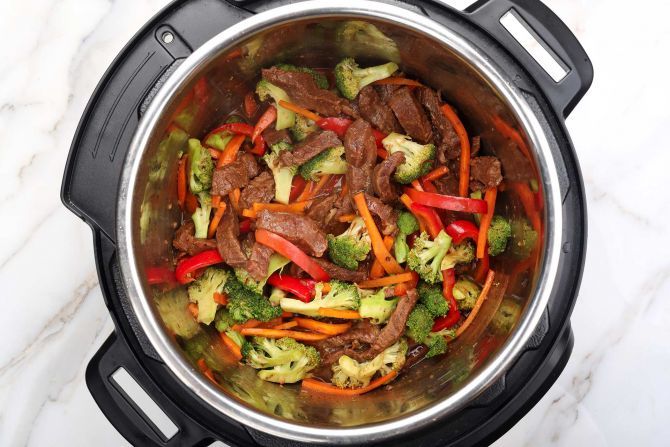 step 5: Release the pressure, reduce the sauce, then add the vegetables
