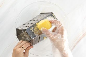 Step 2: Grate the potatoes.