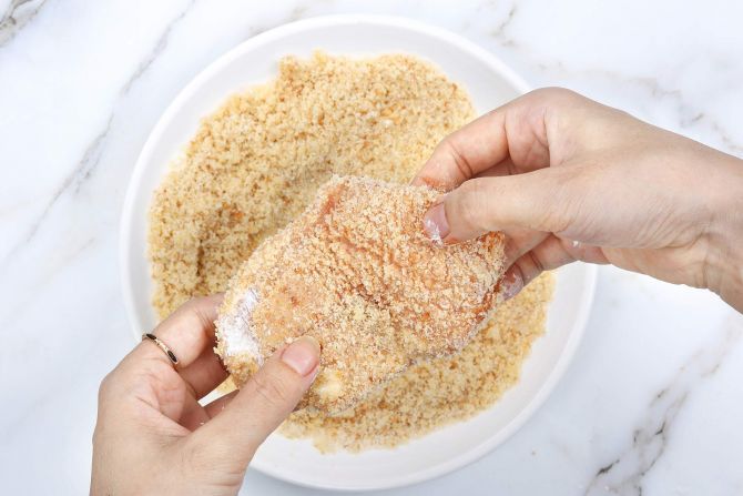 step 6: Coat it in breadcrumbs. Repeat with the other pieces.