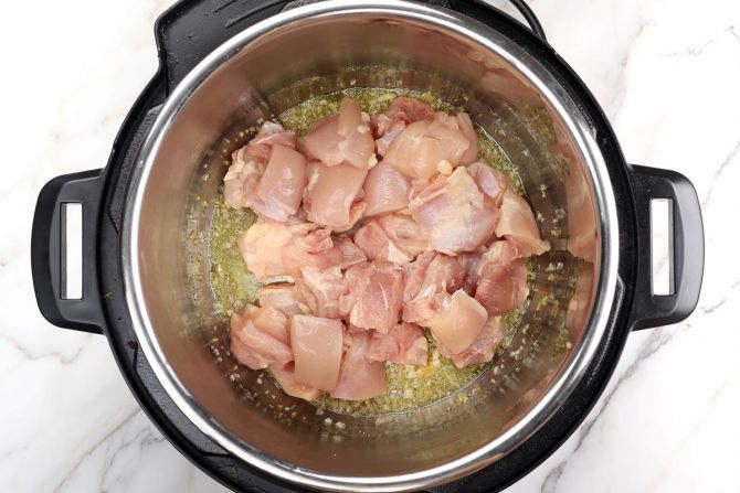 Step 2: Add chicken to the pot and stir occasionally.