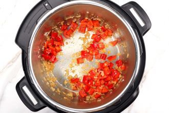 Step 2: Add the red bell peppers. Sauté for 2 minutes until softened.