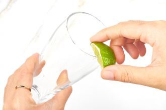 Step 3: Rub the lime wedge around the rim of your serving glass.