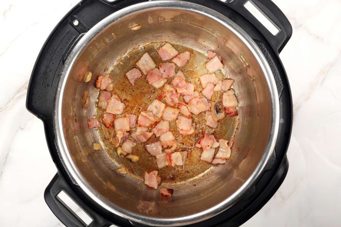 Sauté bacon in olive oil for 1 minute.