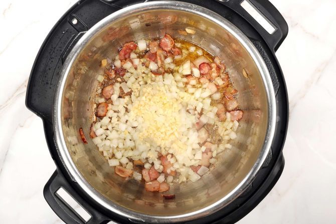 Add garlic and onion. Stir frequently until fragrant.