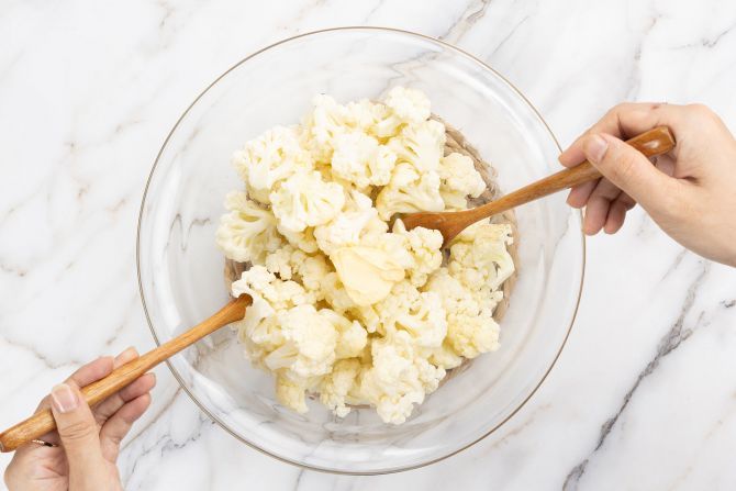 Toss the cauliflower with oil and butter.