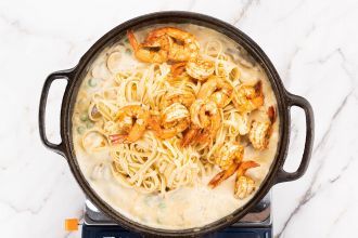 Add the sauce, shrimp, and cooked pasta. Stir.