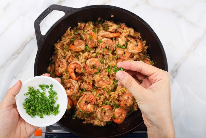 Add the seared shrimp, garnish, and serve.