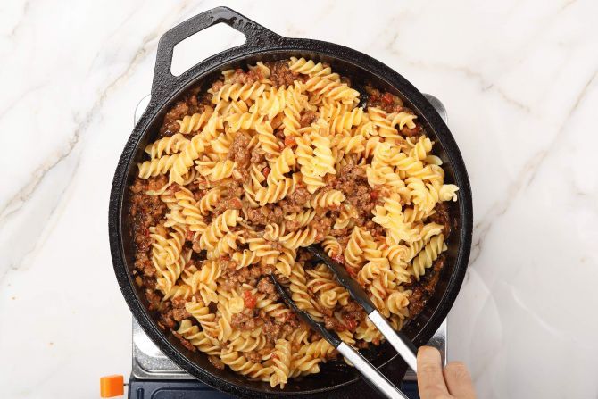 Stir in the pasta and pour into the baking dish.