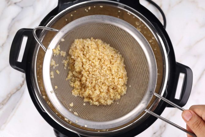 Step 2: Use a fine-mesh sieve to strain the bulgur from water.