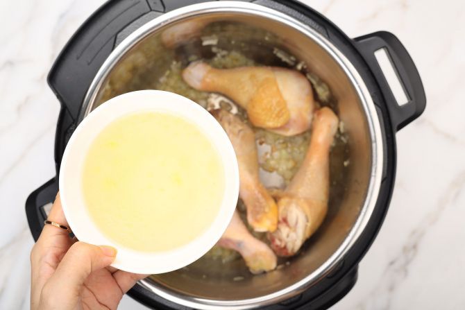 Step 4: Add chicken broth and bay leaf. Close the lid, seal the valve, and cook on the “Meat/Stew” setting.