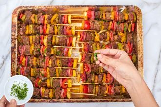 step 6: Remove the kabobs from the oven. Garnish with parsley and serve hot.