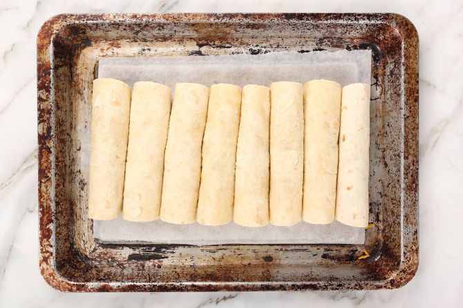 Step 9: Place the rolls onto the baking sheet lined with parchment paper.