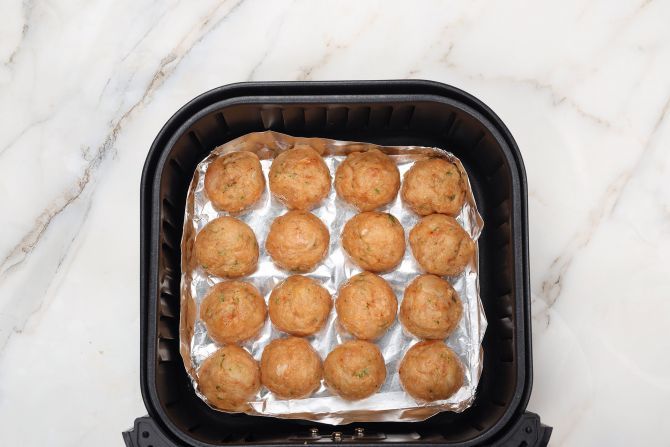 step 4: Form a baking dish from foil and cook the meatballs in it in the air fryer.