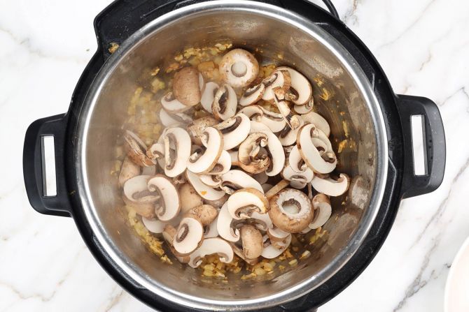 Step 3: Sauté the spices and brown mushrooms.