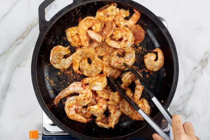 Step 1: Sauté shrimp in melted butter over low heat until pink. Remove to a bowl and set aside.