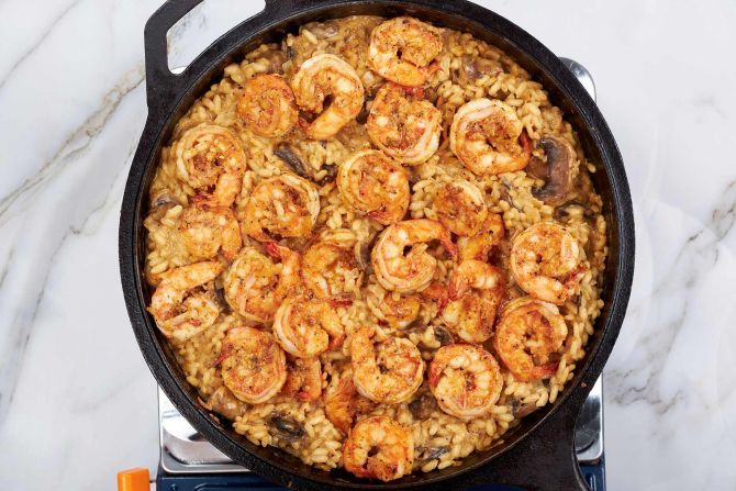 Step 8: Return the cooked shrimp to the skillet and stir it into the risotto.