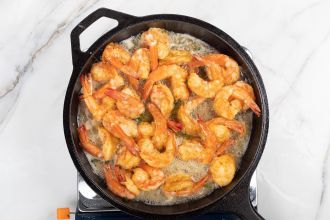 step 5: Add the shrimp and toss with the sauce.
