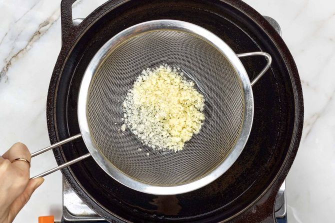 Step 2: Fry the garlic in a skillet. Set aside.