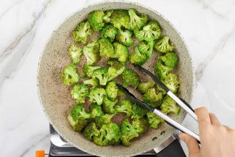 Step 2: Stir-fry broccoli for 5 minutes. Remove to a bowl and set aside.
