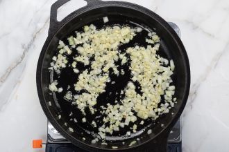 Step 2: On a medium heat pan, sautée olive oil, garlic, and onion.