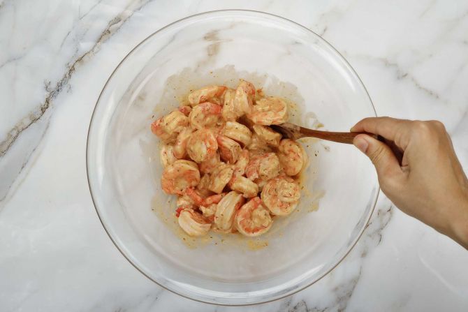 Step 3: Drizzle the remoulade sauce over the shrimp.