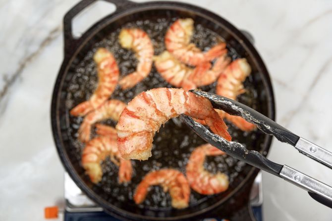Step 4: Fry the shrimp in hot oil until golden brown. Set aside.