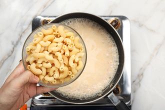 step 6: Add al-dente macaroni and simmer. Preheat the oven to 480°F.